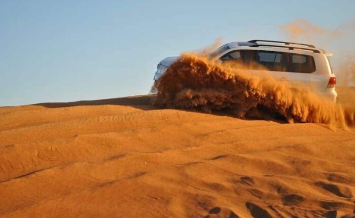 Driving through sand dunes in the Morrocan Sahara in a 4x4 tour