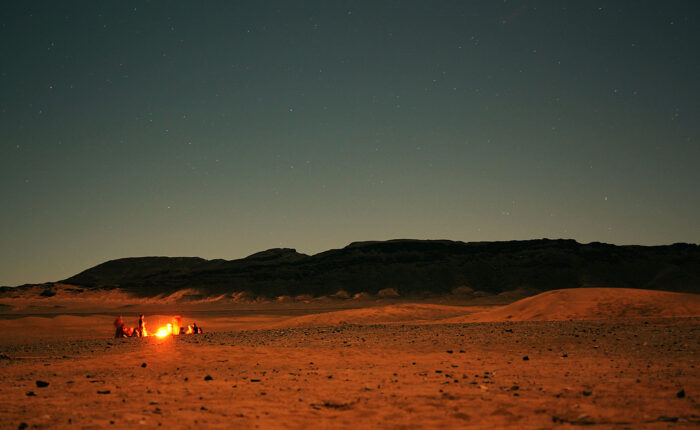 A campfire at sunset in the Moroccan Sahara desert