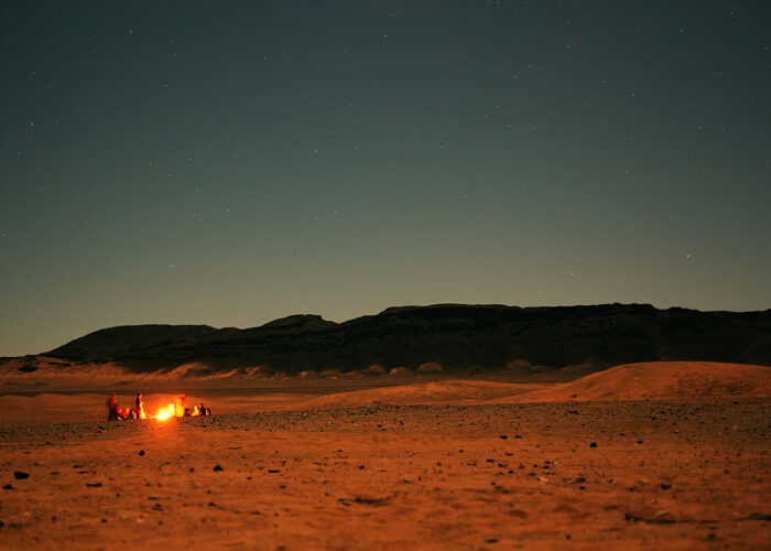 A campfire at sunset in the Moroccan Sahara desert